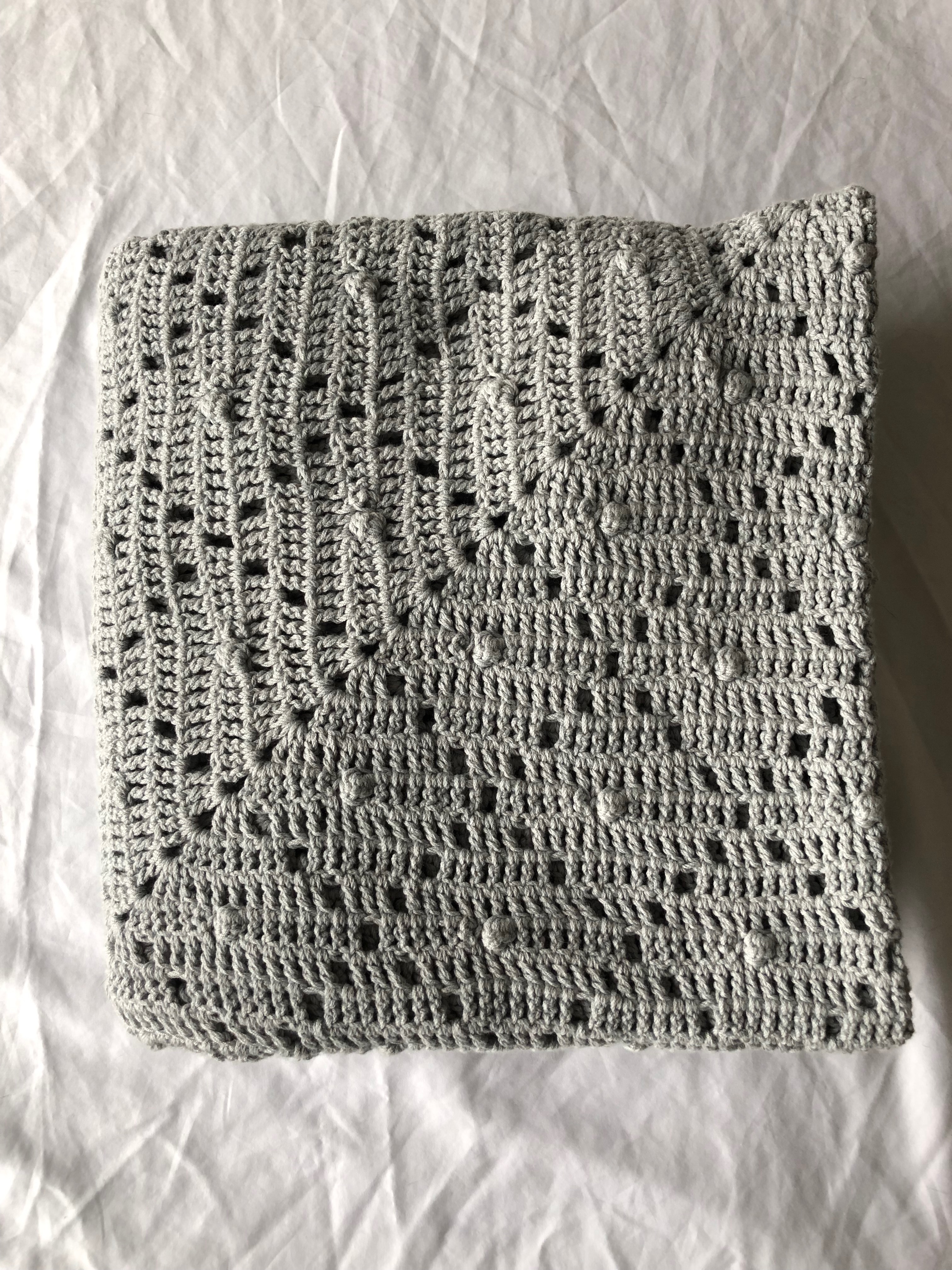 grey crocheted blanket