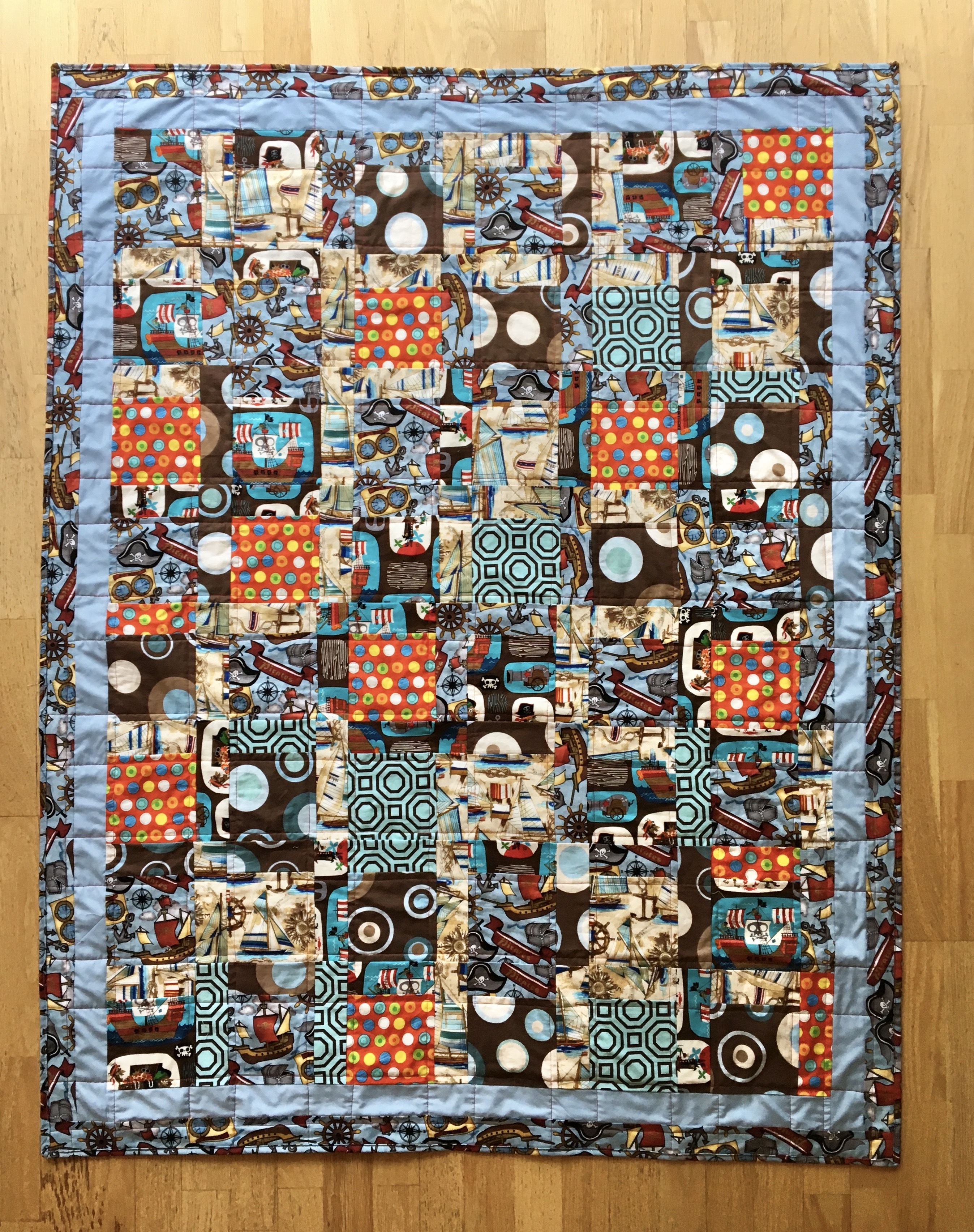blue themed quilt with pirate fabric